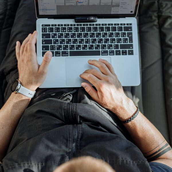 Free A Person Working on His Laptop Stock Photo